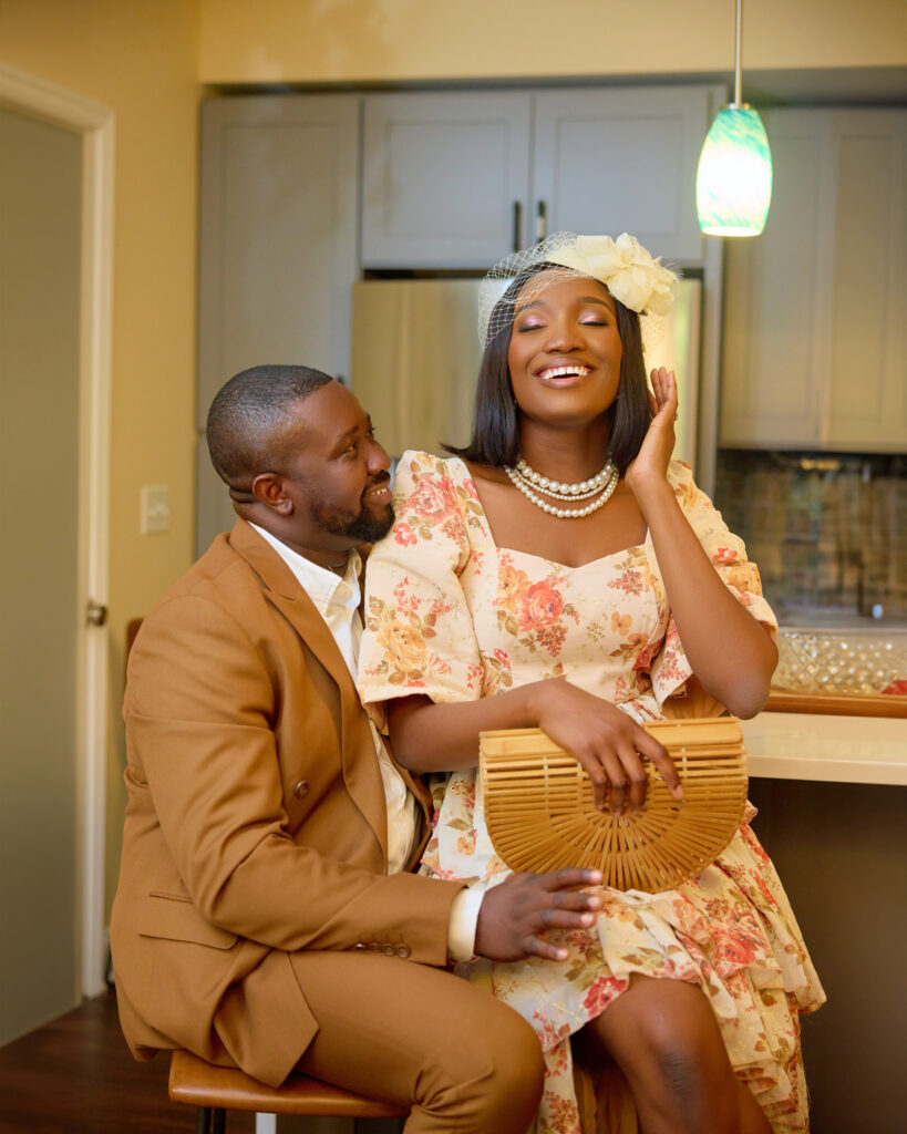 Engaged couple laughing in the kitchen