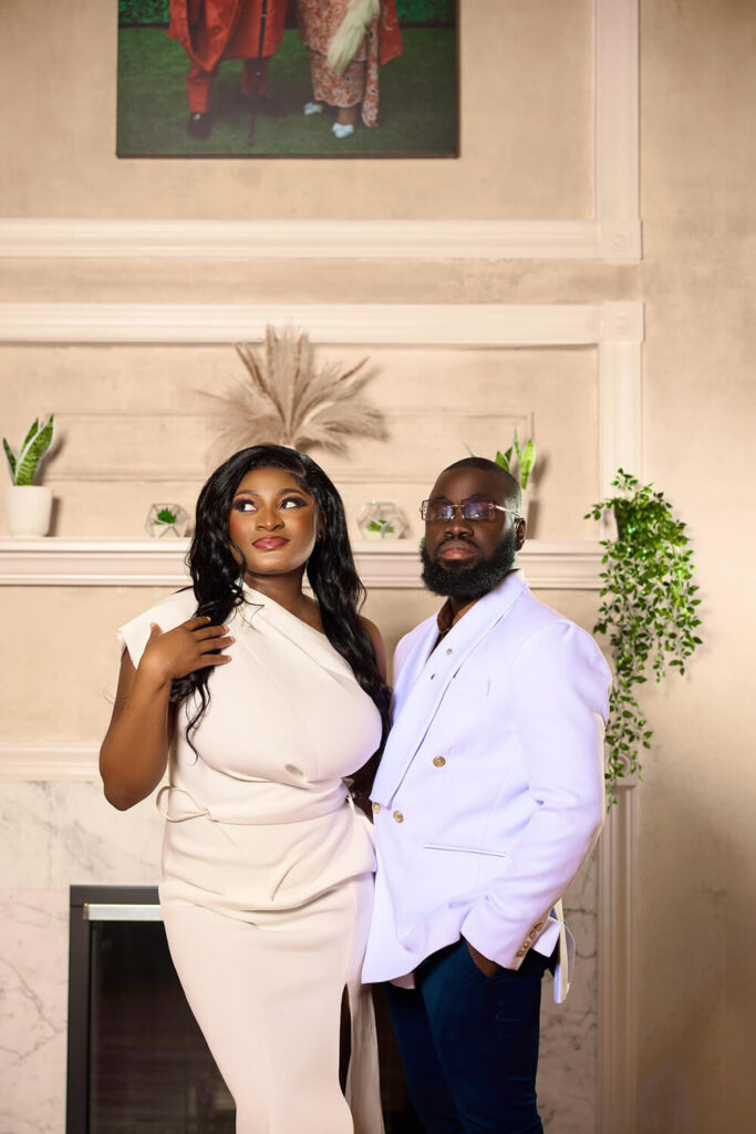 Couple in white outfits at an engagement session