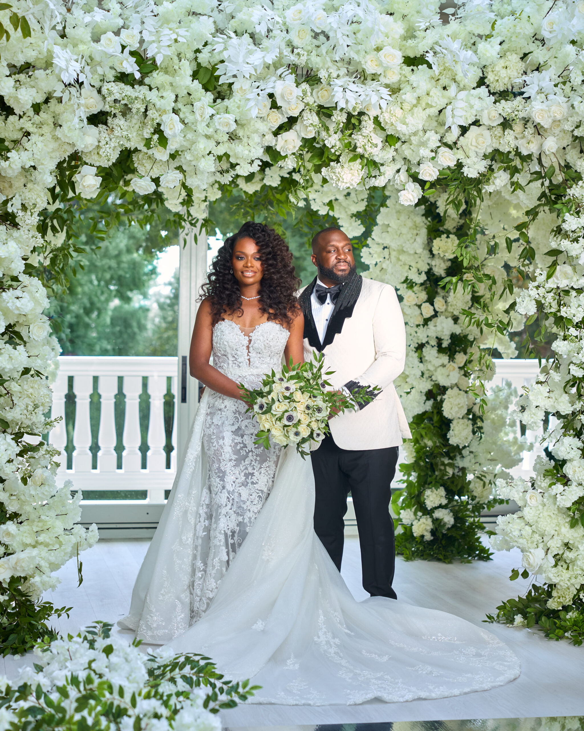 Couple beneath a floral arch