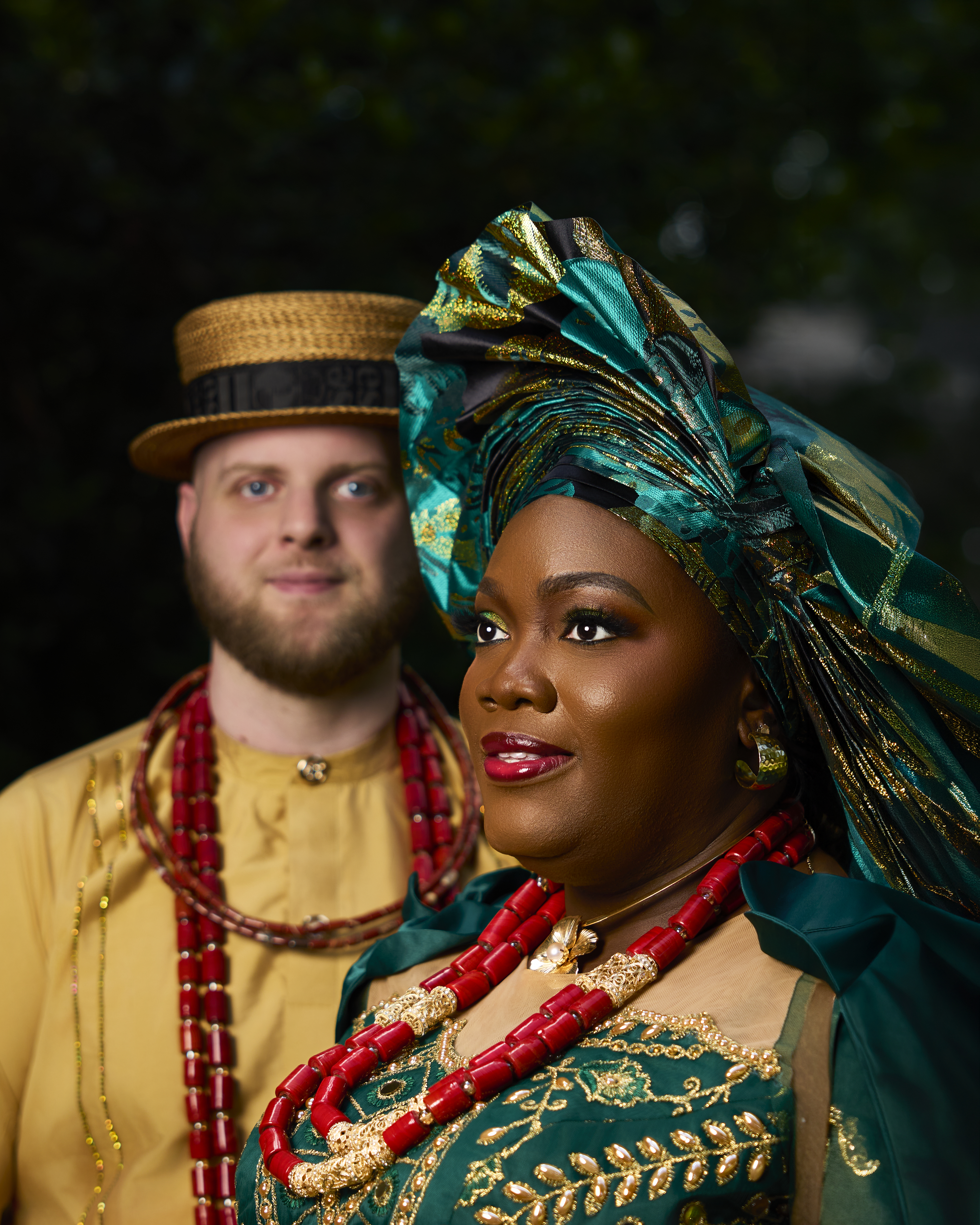 Close portrait of a couple in traditional attire and gele