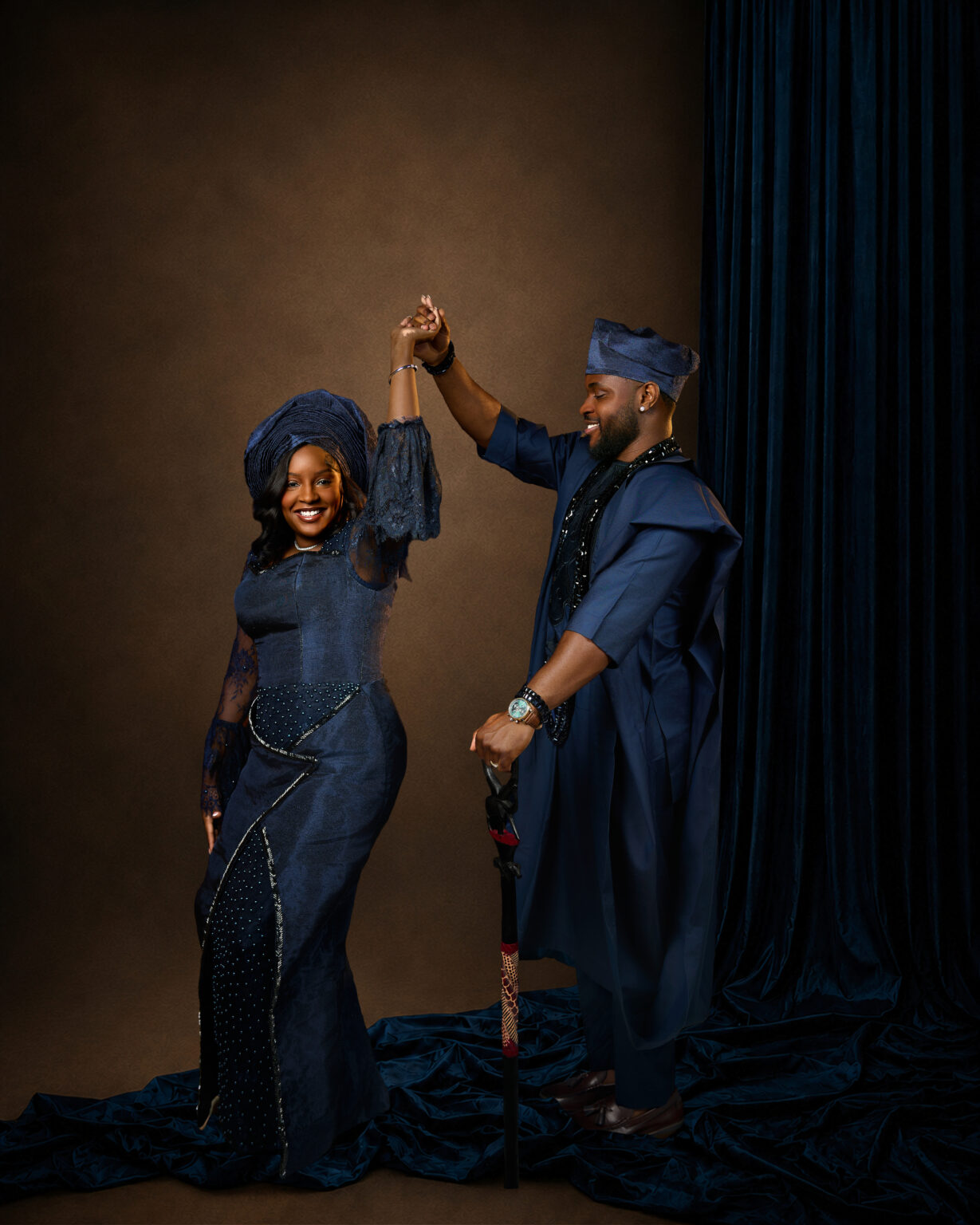 Couple dancing in navy traditional attire