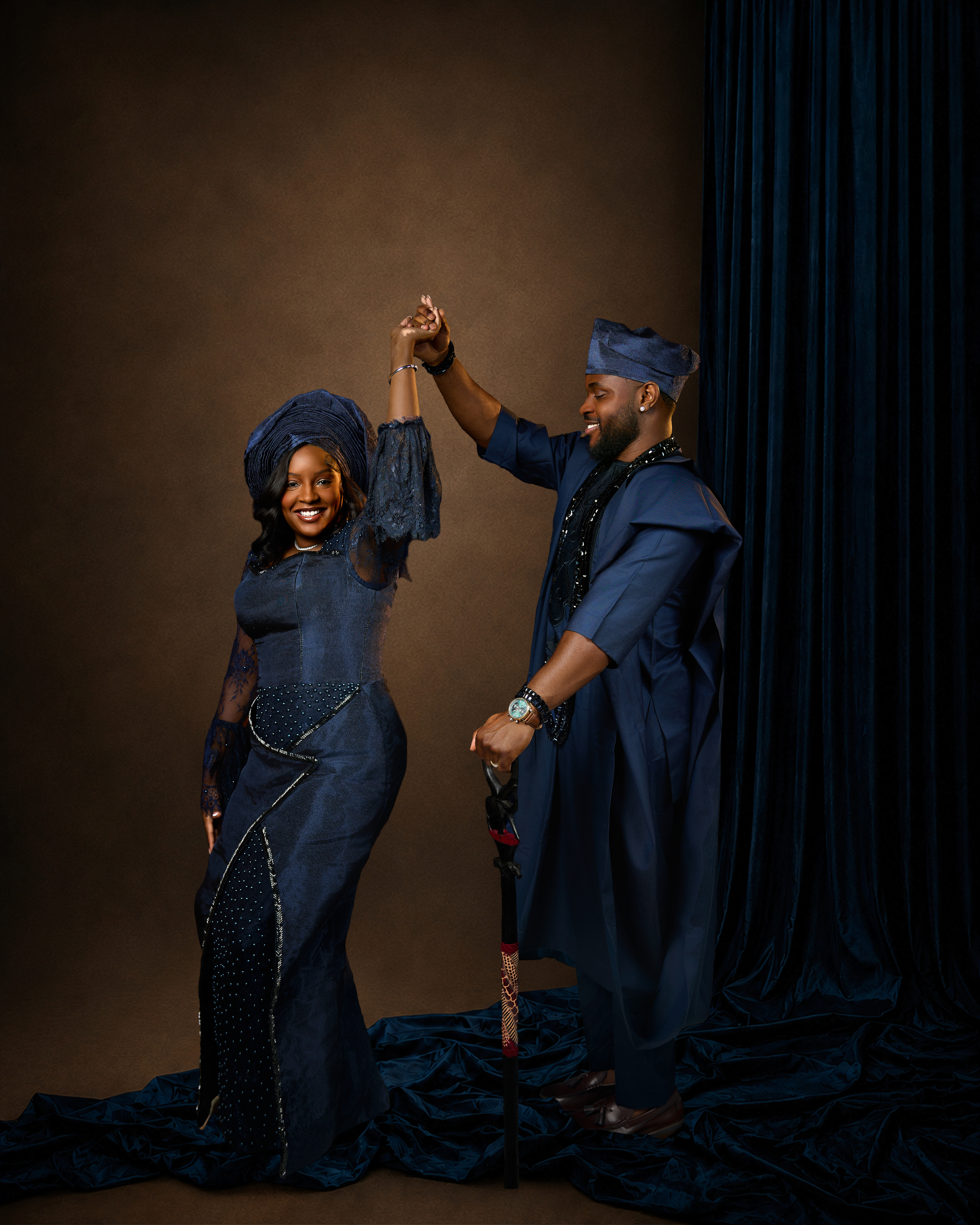 Couple dancing in navy traditional attire